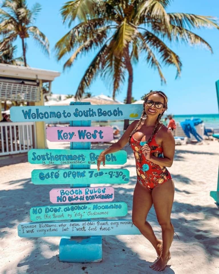 woman by sign posts