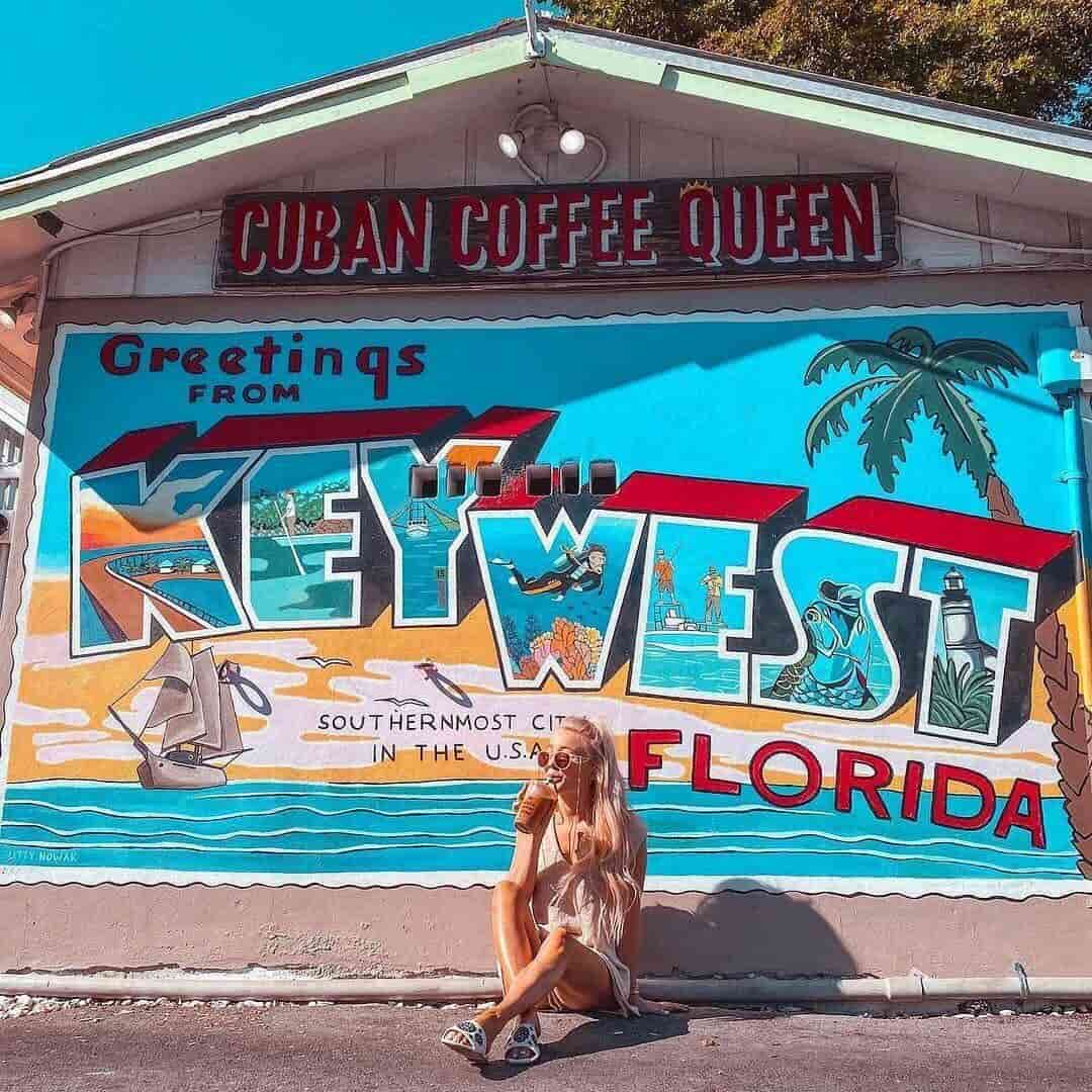 woman under Florida mural 