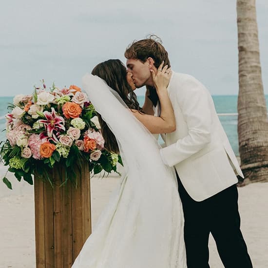 A bride and groom kissing